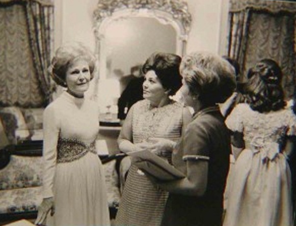 25. At her daughter Julie Nixon's reception following her wedding to David Eisenhower, grandson of President Eisenhower, with Judy Agnew wife of the Vice Preisdnet-elect December 1968.