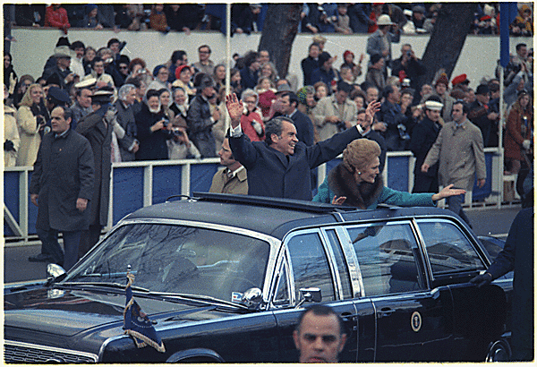 27. The Nixons responding to crowds at the President's second Inauguration in 1973.