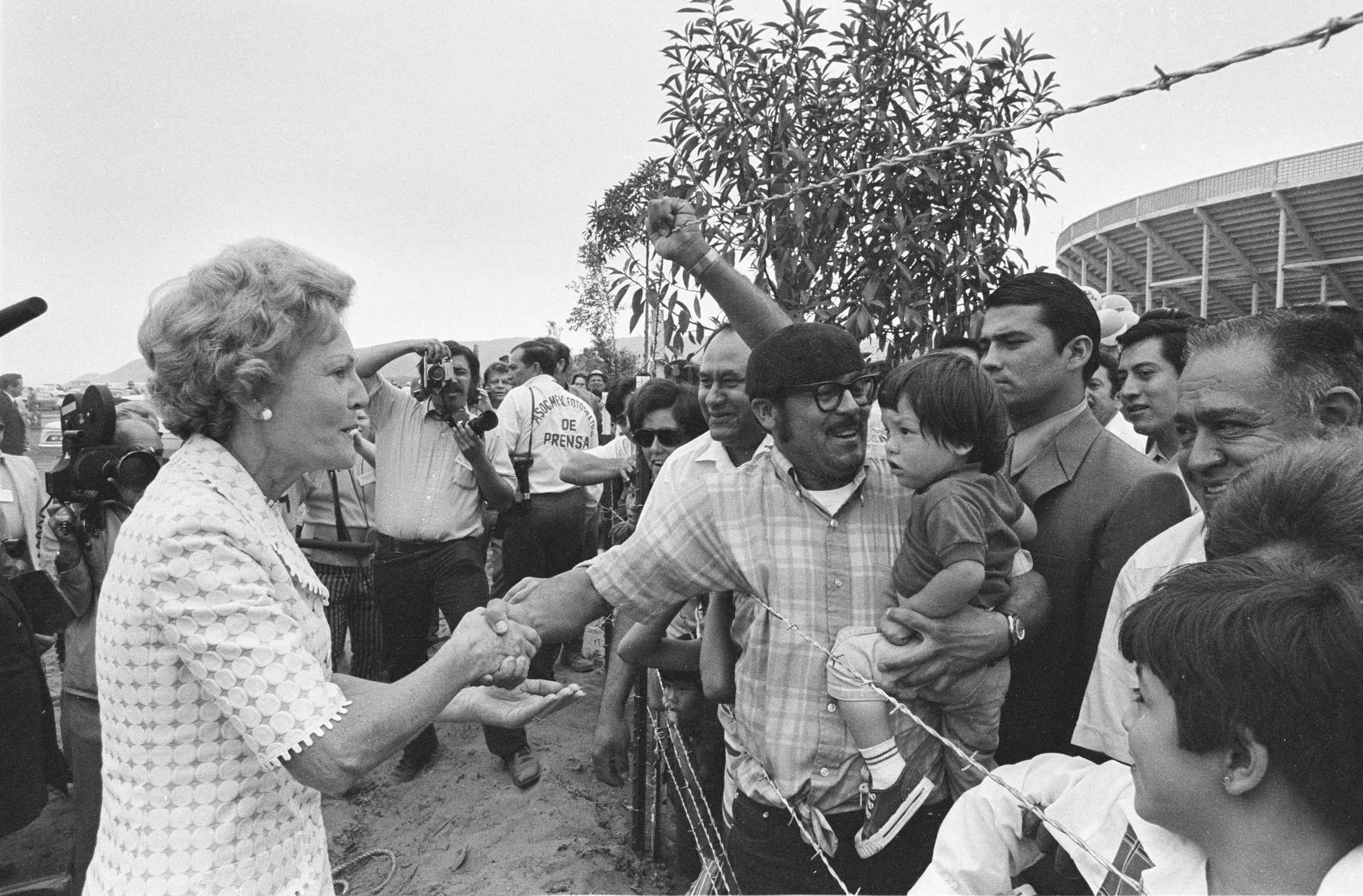 79. Pat Nixon at the barbed wire border fence between the US and Mexico which she asked to have removed.