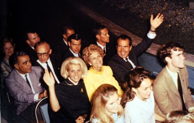 63. In a rare moment of fun, Pat Nixon was joined by her husband and daughters and son-in-law David for a ridfe at Disneyland's Small World ride (disneytoptenlists dot blogspot dot com)