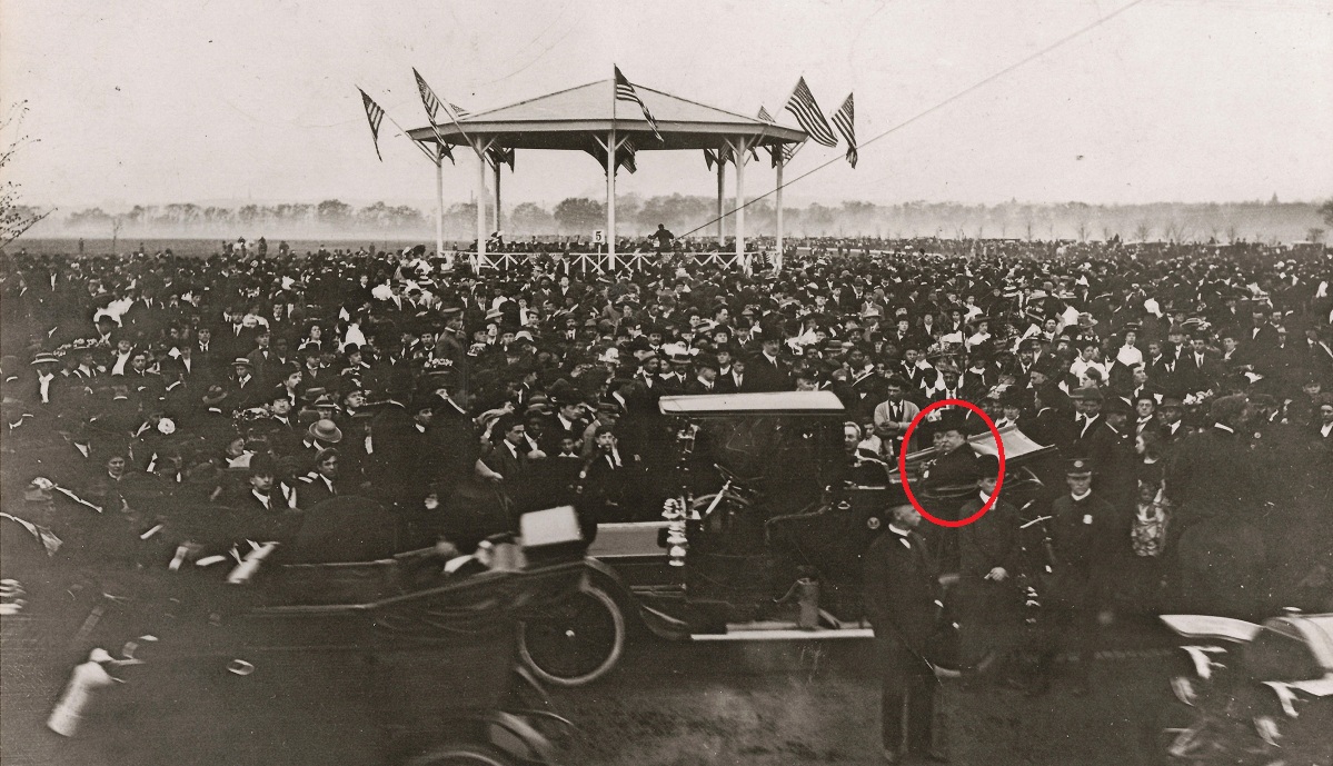 The Tafts (red circle) in their open car pull down to the first concert.