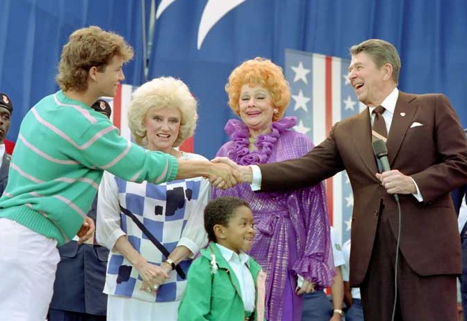 Growing Pains (1985-1992) star Kirk Cameron and Webster (1983-1989) starr Emmanuel Lewis (with Phyllis Diller and Lucille Ball in the middle), at Pope Air Force Base, North Carolina,  for Bob Hope Salute, May 10, 1987