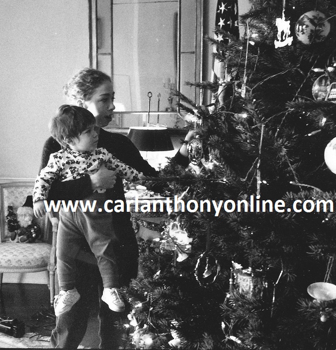 Chelsea Clinton shows her little cousin Zachary Rodham the family's Christmas tree in the Yellow Oval Room.