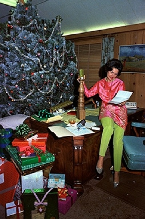 Lady Bird Johnson looking over holiday gifts from friends in the LBJ Ranch office.