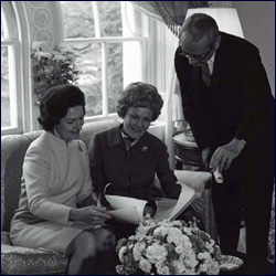 Lady Bird Johnson reviews White House florplan with Pat Nixon before she moved in after her.