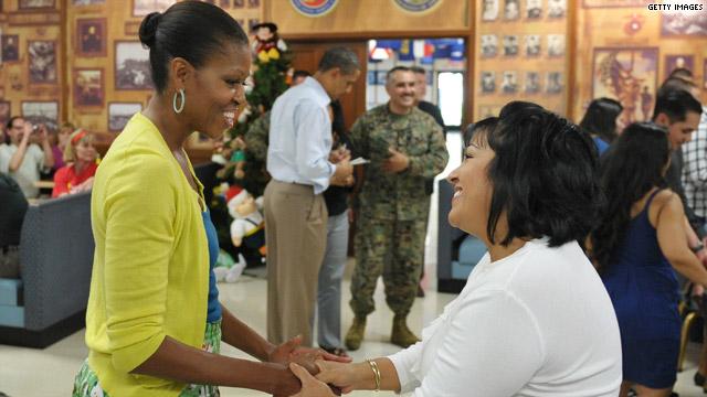 Mrs. Obama at an Armed Service members' service center another year, with the President...