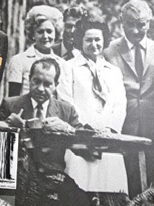 Nixon signs legislation naming Lady Bird Johnson Grove in the Redwood Forest.