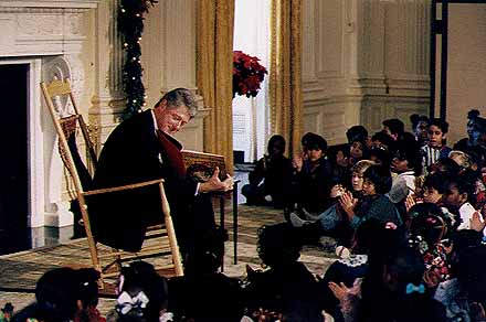 President Bill Clinton reading the Night Before Christmas to area resident children.