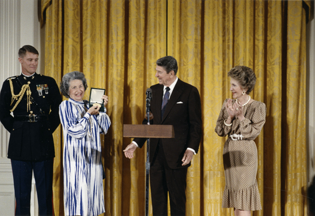 Showing off the Congressional Medal awarded her by the Reagans.