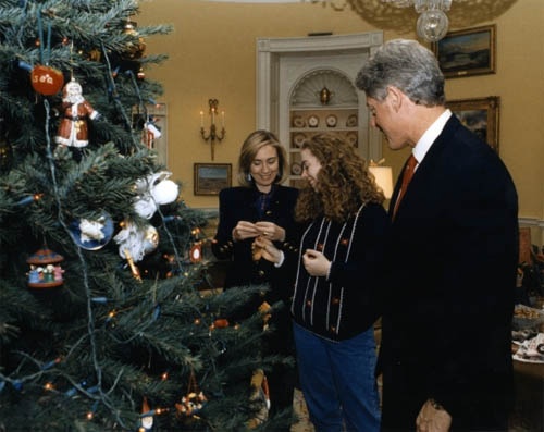The Clintons look over their Blue Room tree.