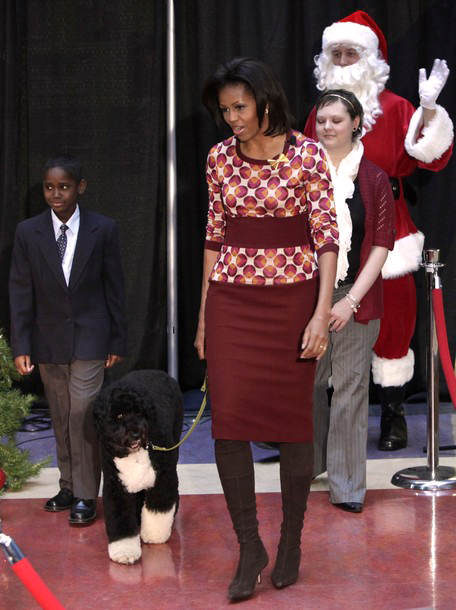 The First Lady at a holiday event with Bo the dog.