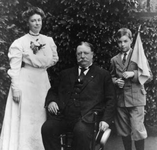 Charlie Taft with his parents, got bored at his dad's inauguration and focused on reading his book Treasure Island.