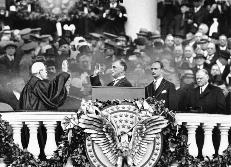 James Roosevelt stood right behind his father FDR at his 1933 Inaugural and in front of outgoing President Hoover.