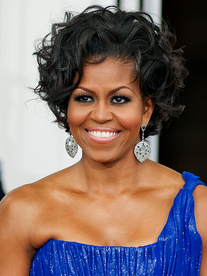 Mrs. Obama with curled hair.