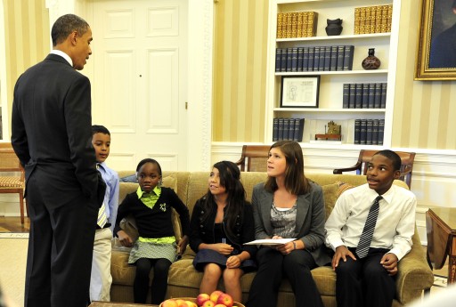 President Obama with school children in the Oval Office (EPA)