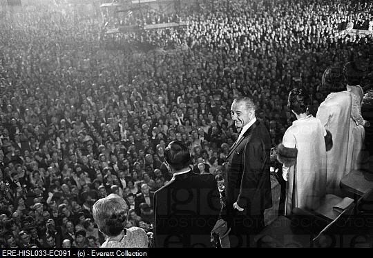 Lynda and Luci Johnson stand at far right next to their mother, overlooking crowds at the 1965 Inaugural Ball.