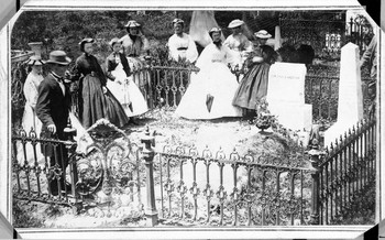 Civil War women of Warrenton decorating graves in a local cemetery plot.