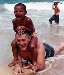 President Obama as a little boy at Waikiki Beach with his grandfather.