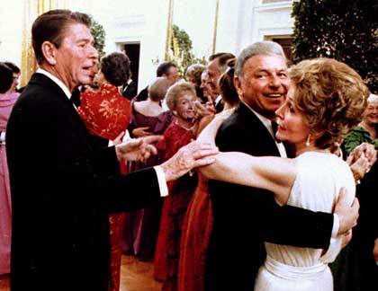 Reagan cuts in on Nancy and Sinatra dancing at his birthday party.