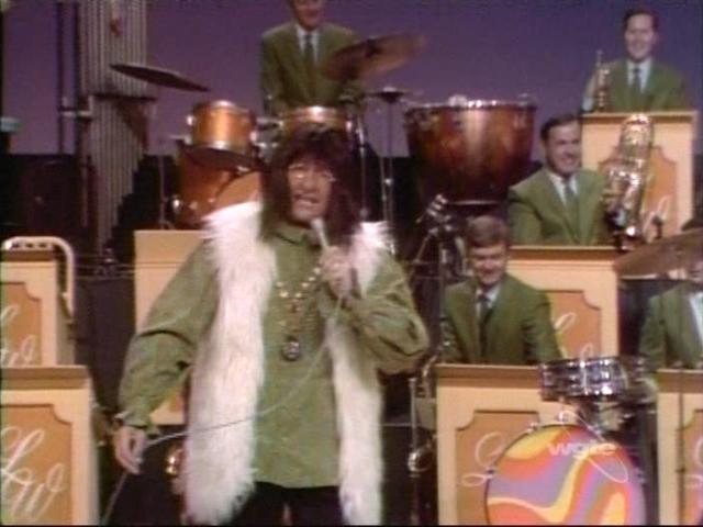 Lawrence Welk goes madly mod as a hip hippie. (welkmusicalfamily.blogspot.com)