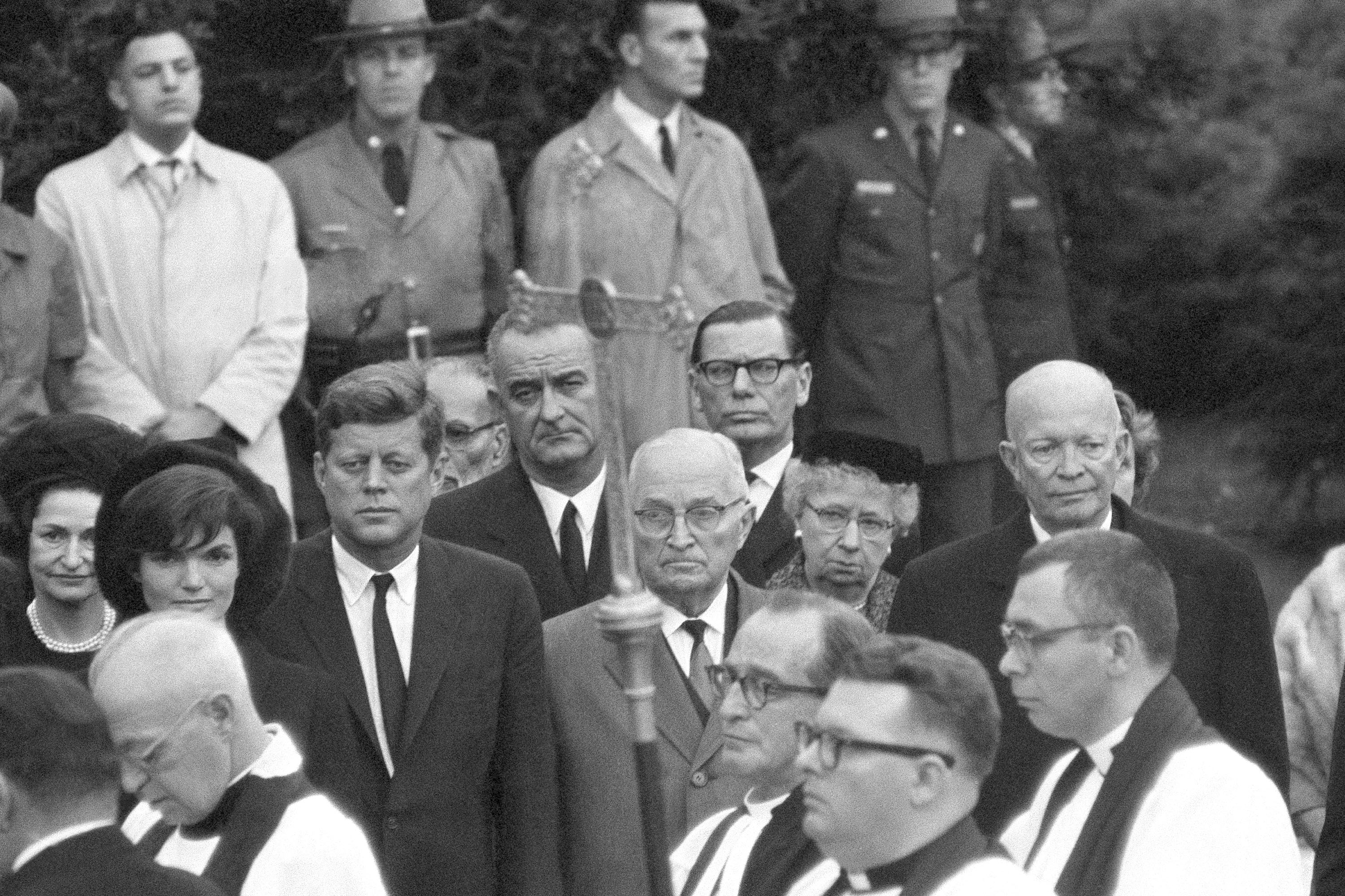 President John F. Kennedy is joined by two former Presidents during services at grave of Mrs. Eleanor Roosevelt in rose garden of the Roosevelt estate at Hyde Park, New York  Nov. 10, 1962. Left to right are: Mrs.Jacqueline , President John Kennedy, Vice President Lyndon Johnson, former President Harry Truman and Mrs. Truman, and former President Dwight Eisenhower. (AP Photo)