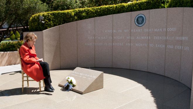Nancy Reagan paying respects at the grave of her late husband, June 2013.