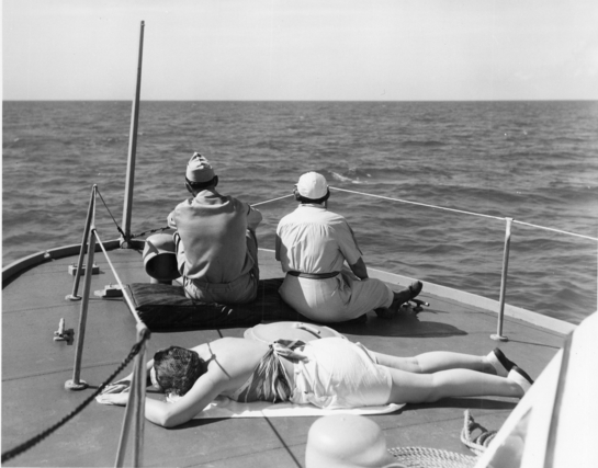 Bess Truman sitting on a boat, as Margaret suntans. (Truman Library)