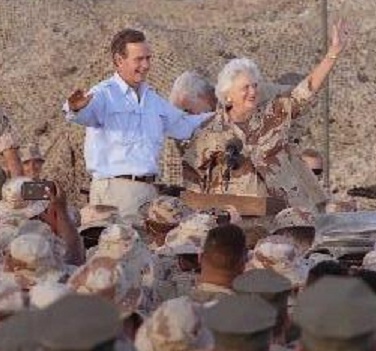 George H. Bush and his wife visiting Gulf War troops.