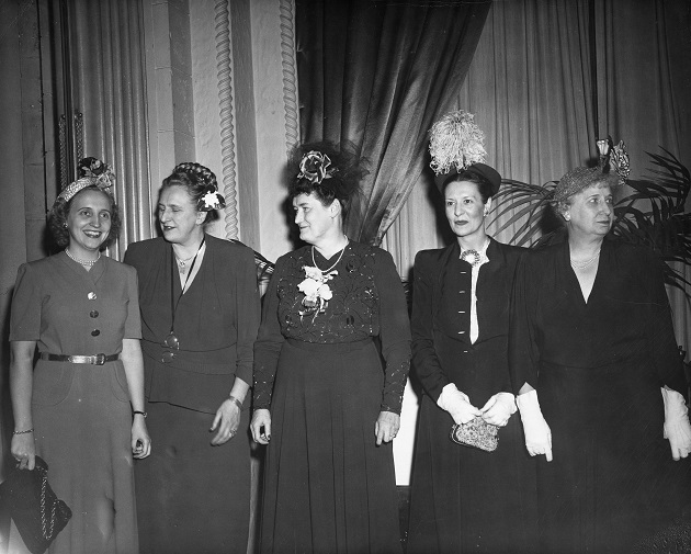 Margaret Truman, far left, seems happyy enough but Bess Truman, far right, looks ready for the reception to end. (Truman Library)