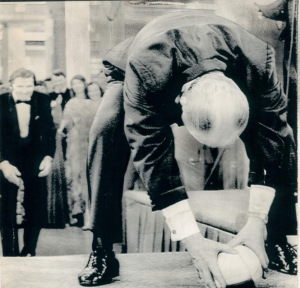 President Ford about to snap the center in November 1974 with a football he signed for a Portland, Oregon museum fundraiser.