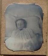 An example of the "ghost baby" photos popular in the Victorian age, where a dead child was posed to look as if asleep and a permanent image of them made before they were buried and their faces forgotten.