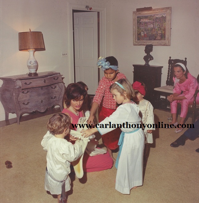 Jackie Kennedy directing her two children, niece, nephew and her aide's son in a Christmas pageant, 1962