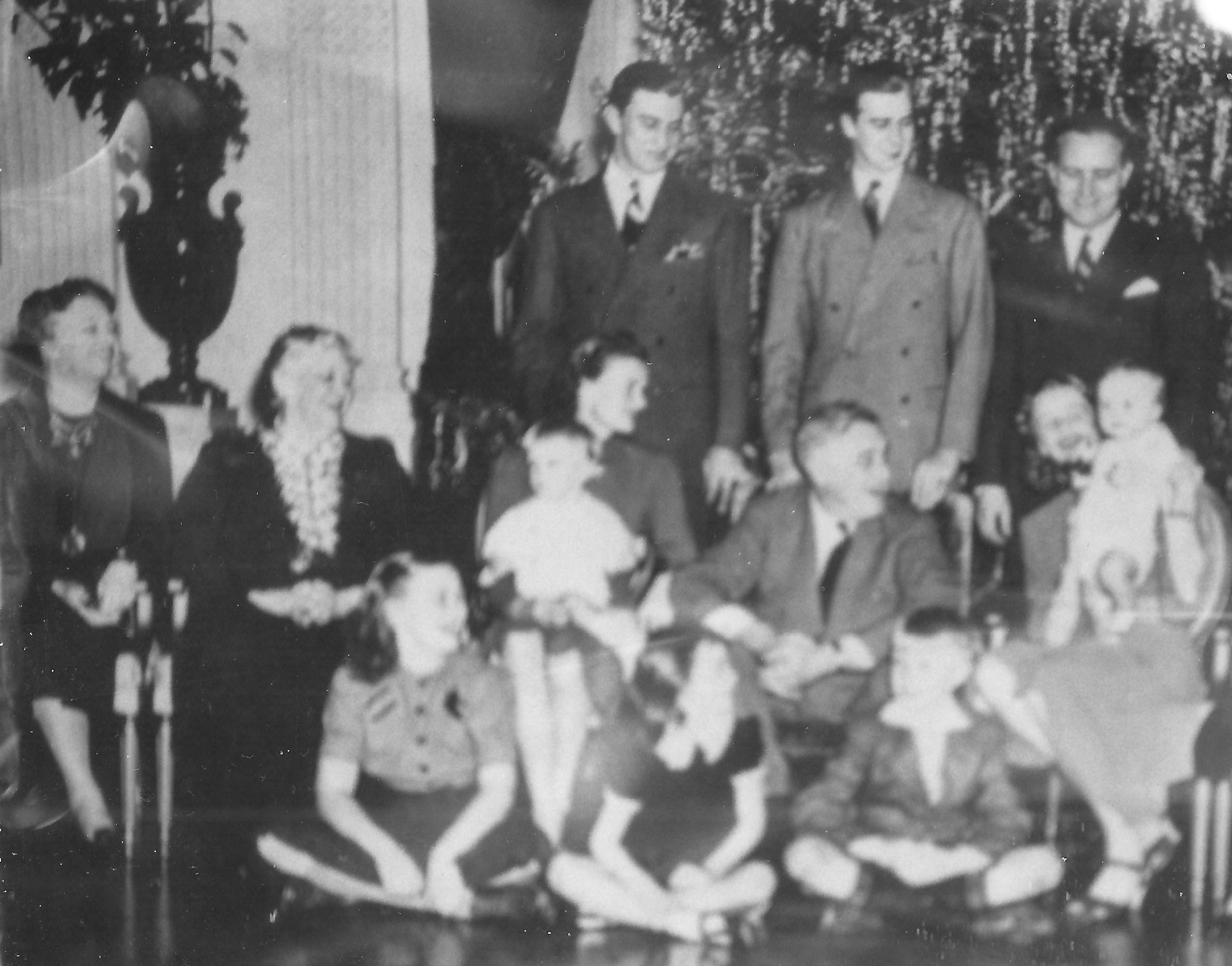 The FDR family during Christmas 1939 in the East Room, the President's wife and mother at far left, his daughter at far right and grandchildren all over.