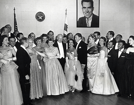 The night after the gala, some performers met with the Eisenhowers. Left to right, Guy Lombardo standing behind an unidentified woman, Fred Waring facing Mrs. Doud, Jeanette MacDonald, Lily Pons and George Murphy